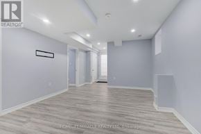 Brampton (Northwest Brampton) apartment for rent - A spacious room with wooden flooring and white walls.
