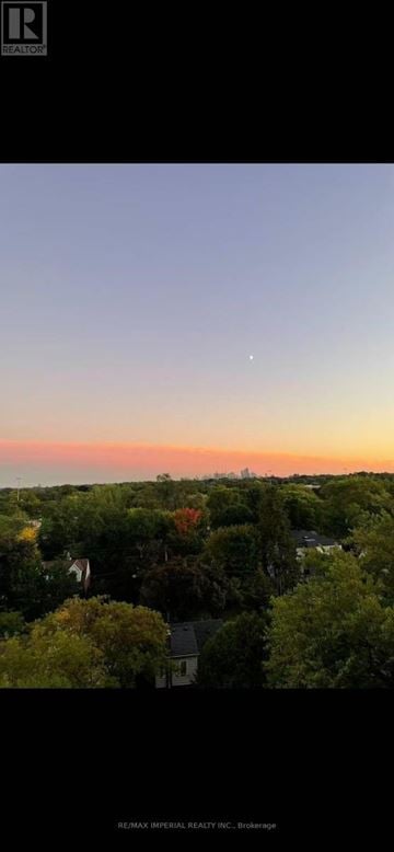 Toronto (Willowdale East) condo for rent - A view of a residential area with houses and trees.