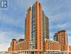 Toronto (Yorkdale-Glen Park) condo for rent - A tall building with a glass facade is the main focus of the image.