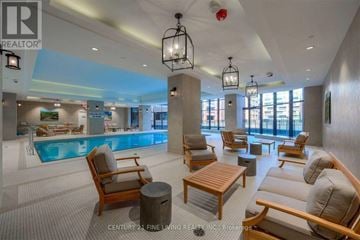 Toronto (Yorkdale-Glen Park) condo for rent - A large, modern living room with a pool table and a fireplace.