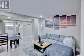Hamilton (Stipley) apartment for rent - A living room with a grey couch and a coffee table.