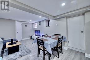 Hamilton (Stipley) apartment for rent - A dining room with a table set for four and a television in the corner.