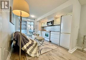 Toronto (Waterfront Communities) condo for rent - A realtor's photo of a small, neatly organized kitchen and living area.