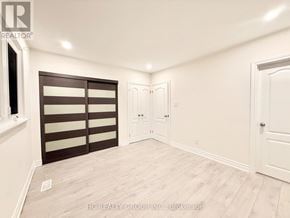 Toronto (Parkwoods-Donalda) apartment for rent - A room with a sliding door and a white door.