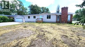 Windsor apartment for rent - A house with a yard in front of it.