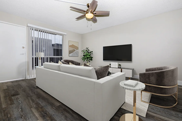 Phoenix apartment for rent - A modern living room with a white sofa and a television.