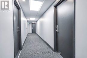 Toronto (West Hill) condo for rent - A long hallway with doors on both sides and a carpeted floor.