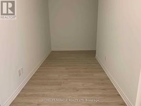 Toronto (West Hill) condo for rent - A room with wooden flooring and white walls.