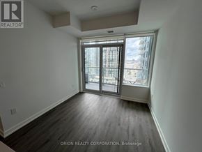 Vaughan (Vaughan Corporate Centre) condo for rent - A room with a sliding glass door leading to a balcony.