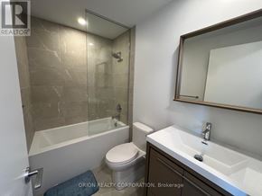 Vaughan (Vaughan Corporate Centre) condo for rent - A bathroom with a toilet, sink, and bathtub.