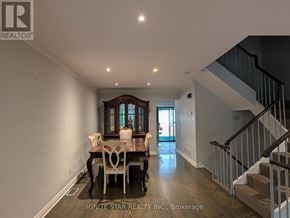 Toronto (Church-Yonge Corridor) townhouse for rent - A dining room with a wooden table and chairs is shown.
