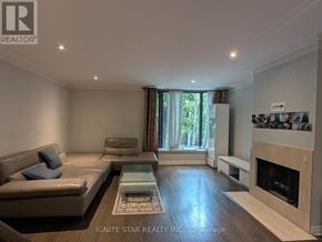 Toronto (Church-Yonge Corridor) townhouse for rent - A living room with a couch, coffee table, and fireplace.