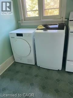 Hamilton apartment for rent - Two white front load washing machines in a laundry room.