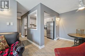 Thorold (Thorold Downtown) condo for rent - A modern kitchen with a refrigerator, sink, and cabinets.