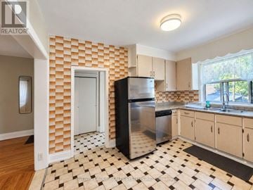 Toronto (Weston-Pellam Park) townhouse for rent - A kitchen with a black and white checkered floor.