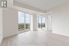 Toronto (Humber Heights) condo for rent - A spacious room with a view of the city through large windows.