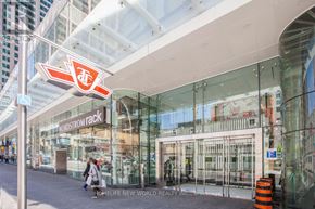 Toronto (Church-Yonge Corridor) condo for rent - A person is walking past a Nordstrom Rack store.