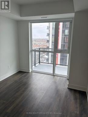 Mississauga (Mississauga Valleys) condo for rent - A room with a view of the city through a large window.