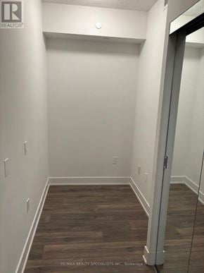 Mississauga (Mississauga Valleys) condo for rent - A room with wooden flooring and white walls.