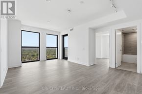 Toronto (Thorncliffe Park) condo for rent - A spacious room with a view of the outdoors through large windows.
