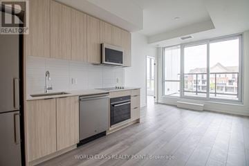 Toronto (Clairlea-Birchmount) condo for rent - A modern kitchen with wooden cabinets and stainless steel appliances.