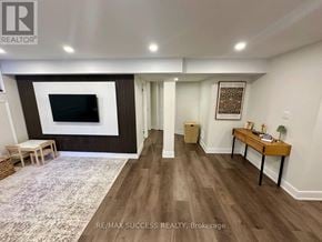Milton (Co Coates) apartment for rent - A living room with a flat screen TV and a wooden bench.