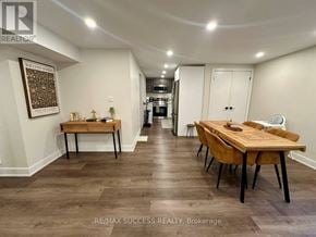 Milton (Co Coates) apartment for rent - A dining room with a wooden table and chairs.