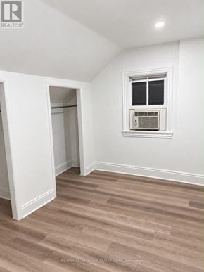 Hamilton (Corktown) apartment for rent - A room with a window and a wall-mounted air conditioner unit.