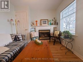 Fort Erie (Crystal Beach) apartment for rent - A living room with a fireplace and a couch.