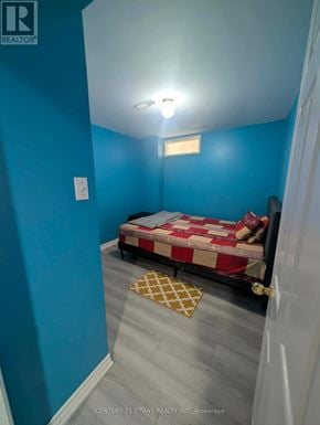 Ajax (South West) apartment for rent - A bedroom with a bed and a light on the ceiling.