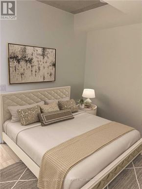 Toronto (Waterfront Communities) condo for rent - A bedroom with a large bed and a painting on the wall.