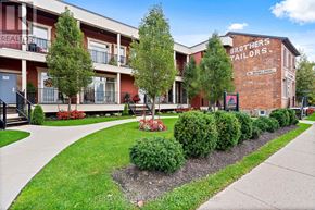 Niagara Falls (Chippawa) condo for rent - A building with the sign "Brothers Tailors" on it.