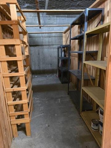 Mission apartment for rent - A room with wooden shelves and a ladder.