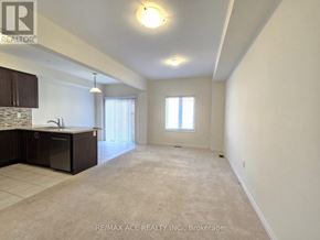 Brant (Paris) townhouse for rent - A spacious room with a kitchen area and a window.