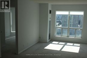 Toronto (Woburn) condo for rent - A room with a large window and a view of a cityscape.