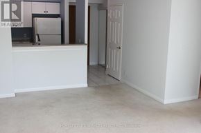 Toronto (Woburn) condo for rent - A white room with a door and a counter.