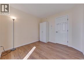 Coquitlam apartment for rent - A room with a wooden floor and a white door.