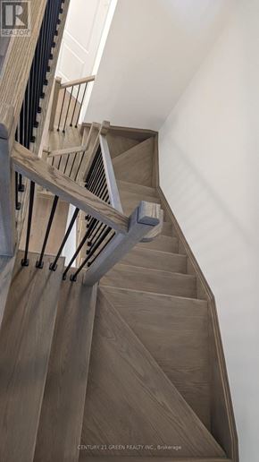 Brampton (Bram West) townhouse for rent - A staircase with wooden steps and a metal railing.