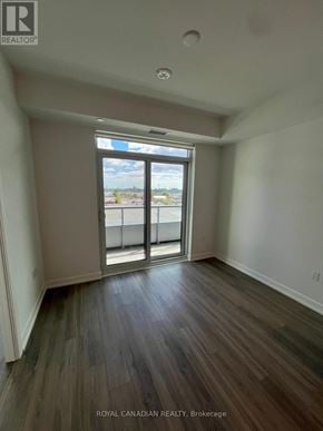 Vaughan (Concord) condo for rent - A room with a sliding glass door leading to a balcony.