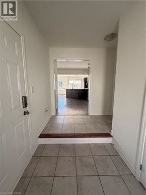 Cambridge townhouse for rent - A hallway with a door on the left and a door on the right.