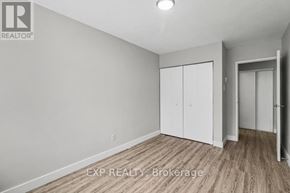 Ottawa condo for rent - A room with a brokerage sign on the wall.