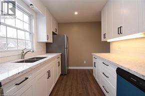 Hamilton apartment for rent - A room with a large window and grey walls.
