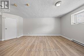 Ottawa condo for rent - A room with EXP Realty Brokerage logo on the floor.