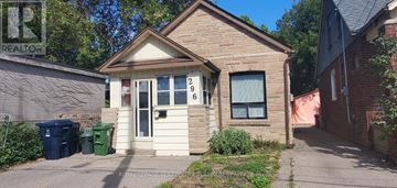 Toronto (Woodbine-Lumsden) apartment for rent - A small house with the number 296 on the window.