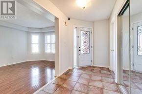 Mississauga (Lisgar) apartment for rent - A room with wooden flooring and a door with a glass panel.