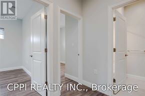 Port Colborne (Main Street) townhouse for rent - A real estate brokerage image showing a hallway with three doors.