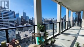 Toronto (Bay Street Corridor) condo for rent - A balcony with a view of the city skyline.
