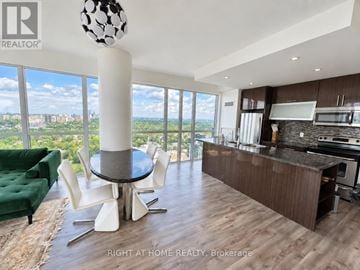 Toronto (Church-Yonge Corridor) condo for rent - A modern kitchen with a dining table and chairs.