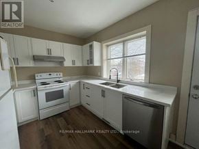 Toronto (South Riverdale) apartment for rent - A kitchen with white cabinets and appliances is for sale.