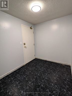 Mississauga (Cooksville) condo for rent - A room with a door and a marble floor.